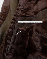 Add a touch of eccentricity to your wardrobe with this vintage 80s long brown leather fur coat. Featuring unique patchwork leather and a cozy fur lining, this XL-XXL coat is perfect for making a bold statement