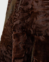 Add a touch of eccentricity to your wardrobe with this vintage 80s long brown leather fur coat. Featuring unique patchwork leather and a cozy fur lining, this XL-XXL coat is perfect for making a bold statement