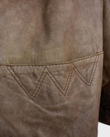 Introducing our must-have Vintage 80s brown/beige leather jacket (used look). It features shoulder pads for a structured look and adds a touch of 80s style to any wardrobe.