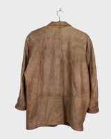 Introducing our must-have Vintage 80s brown/beige leather jacket (used look). It features shoulder pads for a structured look and adds a touch of 80s style to any wardrobe.