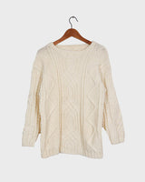 Embrace your love for cable knit with this vintage 80s 90s handknitted white sweater. Perfect for cable knit lovers, this cozy piece is a must-have.