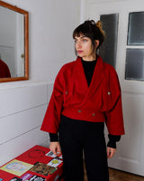 This XS Vintage 80s red wool jacket boasts a timeless and classic appeal with its unique double rows button design. Crafted with high-quality wool fabric, this jacket exudes a refined look.