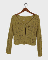 Add some playful personality to your wardrobe with this handmade beige and shimmering yellow cardigan. The light crop fit makes it perfect for layering over any outfit.