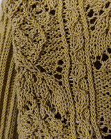 Add some playful personality to your wardrobe with this handmade beige and shimmering yellow cardigan. The light crop fit makes it perfect for layering over any outfit.