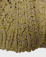 Add some playful personality to your wardrobe with this handmade beige and shimmering yellow cardigan. The light crop fit makes it perfect for layering over any outfit.