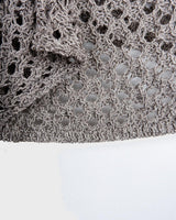 Preloved and handmade, this silver crochet top catches the light with its soft shimmer. The open-knit design and asymmetrical cut give it that effortless, worn-in feel. A rare find that’s easy to style and full of character.