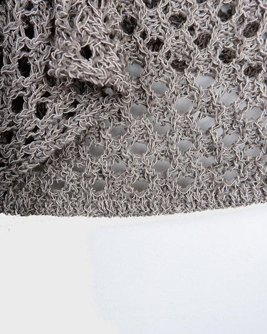 Preloved and handmade, this silver crochet top catches the light with its soft shimmer. The open-knit design and asymmetrical cut give it that effortless, worn-in feel. A rare find that’s easy to style and full of character.