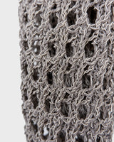 Preloved and handmade, this silver crochet top catches the light with its soft shimmer. The open-knit design and asymmetrical cut give it that effortless, worn-in feel. A rare find that’s easy to style and full of character.