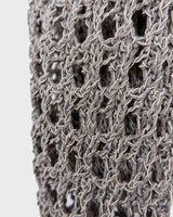 Preloved and handmade, this silver crochet top catches the light with its soft shimmer. The open-knit design and asymmetrical cut give it that effortless, worn-in feel. A rare find that’s easy to style and full of character.