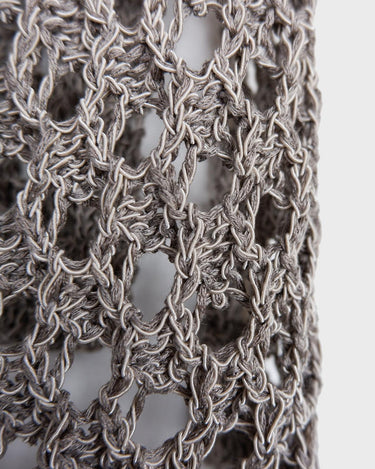 Preloved and handmade, this silver crochet top catches the light with its soft shimmer. The open-knit design and asymmetrical cut give it that effortless, worn-in feel. A rare find that’s easy to style and full of character.