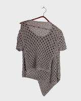 Preloved and handmade, this silver crochet top catches the light with its soft shimmer. The open-knit design and asymmetrical cut give it that effortless, worn-in feel. A rare find that’s easy to style and full of character.