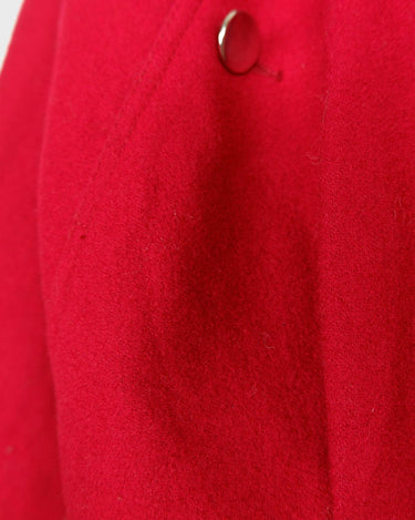 This XS Vintage 80s red wool jacket boasts a timeless and classic appeal with its unique double rows button design. Crafted with high-quality wool fabric, this jacket exudes a refined look.