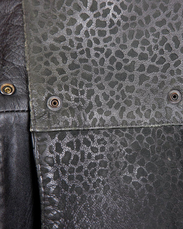 This vintage 80s coat features a fierce black animal print, adding a unique touch to any outfit. The belted waist cinches in for a flattering fit, making you feel confident and channeling your inner wild side.