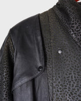 This vintage 80s coat features a fierce black animal print, adding a unique touch to any outfit. The belted waist cinches in for a flattering fit, making you feel confident and channeling your inner wild side.