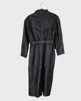 This vintage 80s coat features a fierce black animal print, adding a unique touch to any outfit. The belted waist cinches in for a flattering fit, making you feel confident and channeling your inner wild side.