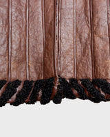 Looking for a statement piece? Look no further! This Vintage 80s brown leather coat with black real fur is a versatile addition to any wardrobe. Its unique design and edgy style make it perfect for you!