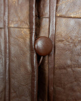 Looking for a statement piece? Look no further! This Vintage 80s brown leather coat with black real fur is a versatile addition to any wardrobe. Its unique design and edgy style make it perfect for you!