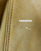Cozy up in this vintage 80s shearling coat, perfect for chilly days. Its rich brown and mustard yellow colors add a bold touch, while the shearling material provides warmth and comfort. A must-have piece for your wardrobe, this coat is a timeless addition that will never go out of style.