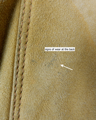 Cozy up in this vintage 80s shearling coat, perfect for chilly days. Its rich brown and mustard yellow colors add a bold touch, while the shearling material provides warmth and comfort. A must-have piece for your wardrobe, this coat is a timeless addition that will never go out of style.