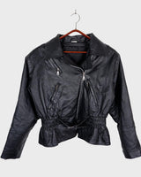 Unleash your inner badass with this Vintage 80s black biker leather jacket. The edgy look is complete with a belted waist and light shoulder pads, making it the perfect statement piece for spring. Crafted from light leather, it provides style and comfort.