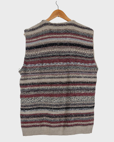 Layer up your look with this classic vintage wool vest! This 80s / 90s boho vest will add a splash of color to any outfit.