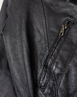 Unleash your inner badass with this Vintage 80s black biker leather jacket. The edgy look is complete with a belted waist and light shoulder pads, making it the perfect statement piece for spring. Crafted from light leather, it provides style and comfort.
