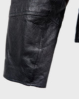 Unleash your inner badass with this Vintage 80s black biker leather jacket. The edgy look is complete with a belted waist and light shoulder pads, making it the perfect statement piece for spring. Crafted from light leather, it provides style and comfort.