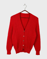 Add a pop of elegance to any outfit with this vintage 80s red cable knit cardigan. The statement red color makes a bold fashion statement.