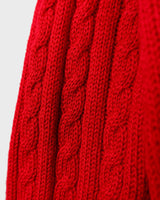 Add a pop of elegance to any outfit with this vintage 80s red cable knit cardigan. The statement red color makes a bold fashion statement.
