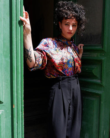 This eye-catching, color-popping 90s vintage blouse is just what your wardrobe yearned for! A timeless addition, the bold baroque print will add a funky flair to any outfit. Super-shiny fabric shimmers and shines, making it a must-have piece for sure!