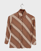 Get groovy with this vintage 70s brown dotted blouse in XS! Bring some playful vibes to your wardrobe with this unique throwback piece.