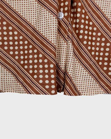 Get groovy with this vintage 70s brown dotted blouse in XS! Bring some playful vibes to your wardrobe with this unique throwback piece.