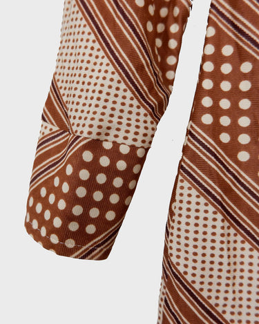 Get groovy with this vintage 70s brown dotted blouse in XS! Bring some playful vibes to your wardrobe with this unique throwback piece.