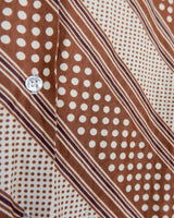 Get groovy with this vintage 70s brown dotted blouse in XS! Bring some playful vibes to your wardrobe with this unique throwback piece.