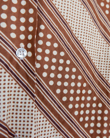 Get groovy with this vintage 70s brown dotted blouse in XS! Bring some playful vibes to your wardrobe with this unique throwback piece.