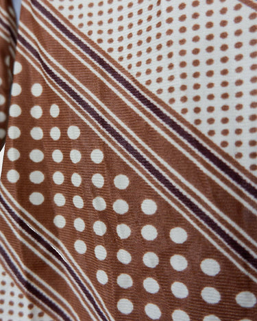 Get groovy with this vintage 70s brown dotted blouse in XS! Bring some playful vibes to your wardrobe with this unique throwback piece.