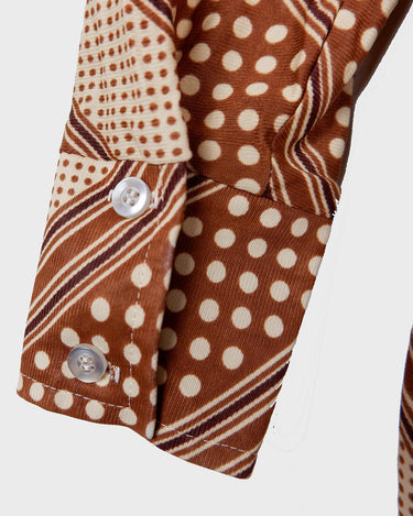 Get groovy with this vintage 70s brown dotted blouse in XS! Bring some playful vibes to your wardrobe with this unique throwback piece.