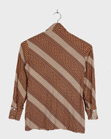 Get groovy with this vintage 70s brown dotted blouse in XS! Bring some playful vibes to your wardrobe with this unique throwback piece.