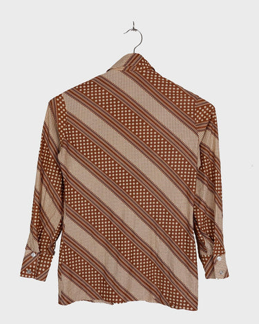 Get groovy with this vintage 70s brown dotted blouse in XS! Bring some playful vibes to your wardrobe with this unique throwback piece.