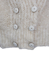 Get ready to cozy up with this vintage 80s boho-style cardigan! Crafted from a mohair mix, this playful cardigan features real fur balls for a unique twist