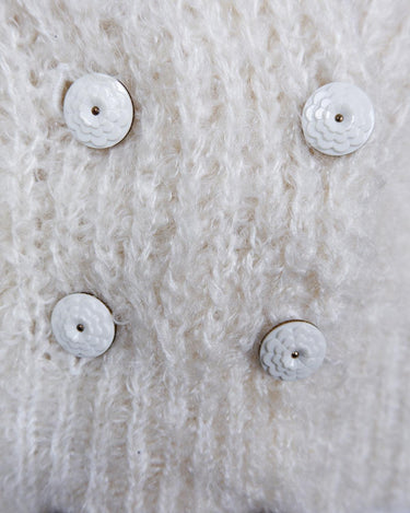 Get ready to cozy up with this vintage 80s boho-style cardigan! Crafted from a mohair mix, this playful cardigan features real fur balls for a unique twist