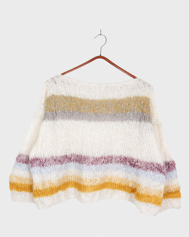 Experience the handmade goodness of our mohair spring/summer sweater! With its boxy cut and oversized fit, this sweater offers both style and comfort. Perfect for any season, this sweater is a must-have for any fashion-forward individual.