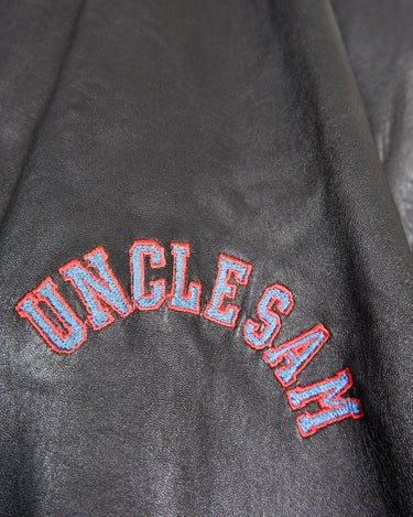 Unleash your inner rebel with this Vintage 80s Uncle Sam bomber leather jacket in size XL. Featuring a laid back, old-school vibe, this jacket exudes coolness and effortless style