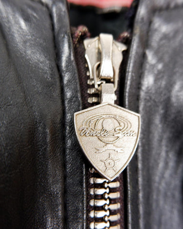 Unleash your inner rebel with this Vintage 80s Uncle Sam bomber leather jacket in size XL. Featuring a laid back, old-school vibe, this jacket exudes coolness and effortless style