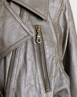 Unleash your wild side with the Premium Vintage 80s Dino'Z golden biker leather jacket! This unique piece features a thin material, making it perfect for spring. Who's ready to rock this golden leather jacket?