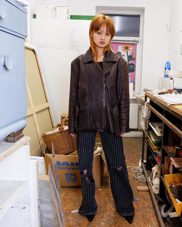 Look sharp in this vintage 80s chocolate brown belted biker leather jacket! Be the baddest biker on the block with this classic piece. Perfect for adding some edge to your look with a bit of attitude. Get ready to hit the highway!