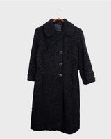 Wrap yourself in elegance with this vintage 80s 90s black real fur coat. This timeless piece adds a touch of luxury to any outfit. 