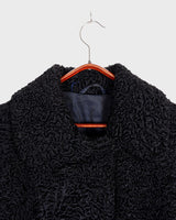 Wrap yourself in elegance with this vintage 80s 90s black real fur coat. This timeless piece adds a touch of luxury to any outfit. 
