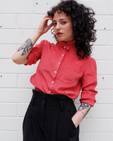 You can never go wrong with a classic! This Vintage 80s / 90s red blouse with the volant collar is as timeless as it gets. Lightweight and smooth, it's the perfect way to spruce up any outfit! Plus, what could be cuter than the unique pattern this blouse features? Get your hands on this timeless piece today!