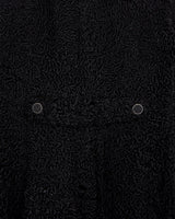 Wrap yourself in elegance with this vintage 80s 90s black real fur coat. This timeless piece adds a touch of luxury to any outfit.